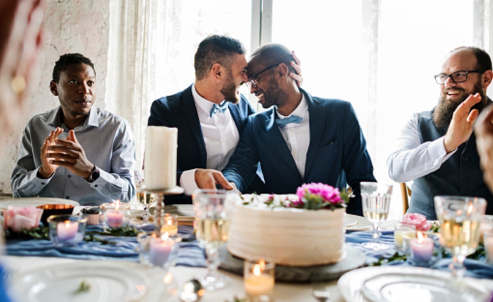 two men hugging, celebrating their wedding