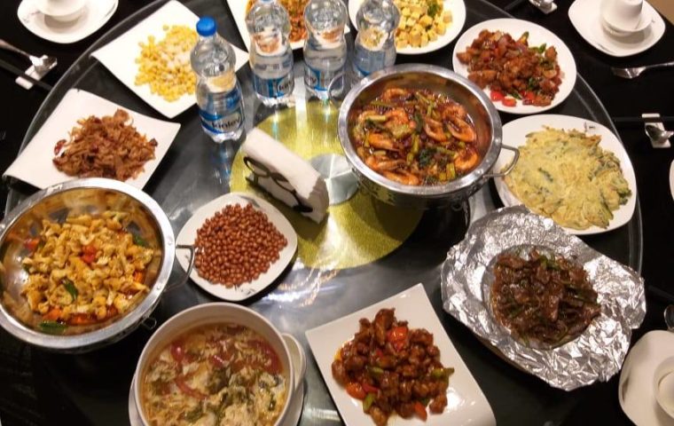 a display of Asian dishes on a lazy Susan, ready to be eaten