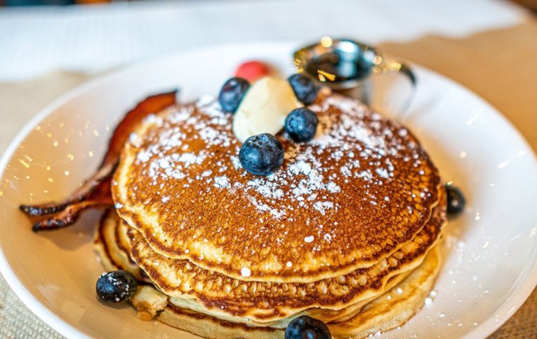 buttermilk pancakes with blueberries and pecanwood smoked bacon