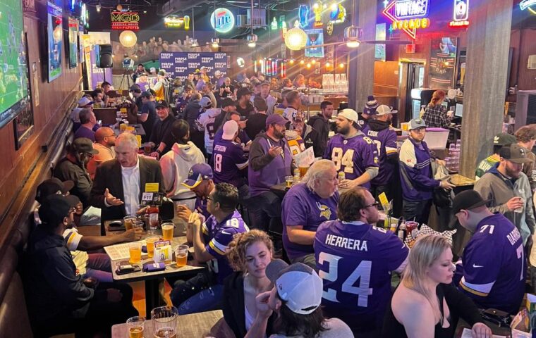 A group of Vikings Fans celebrating at the Park Tavern's 11th Frame Bar