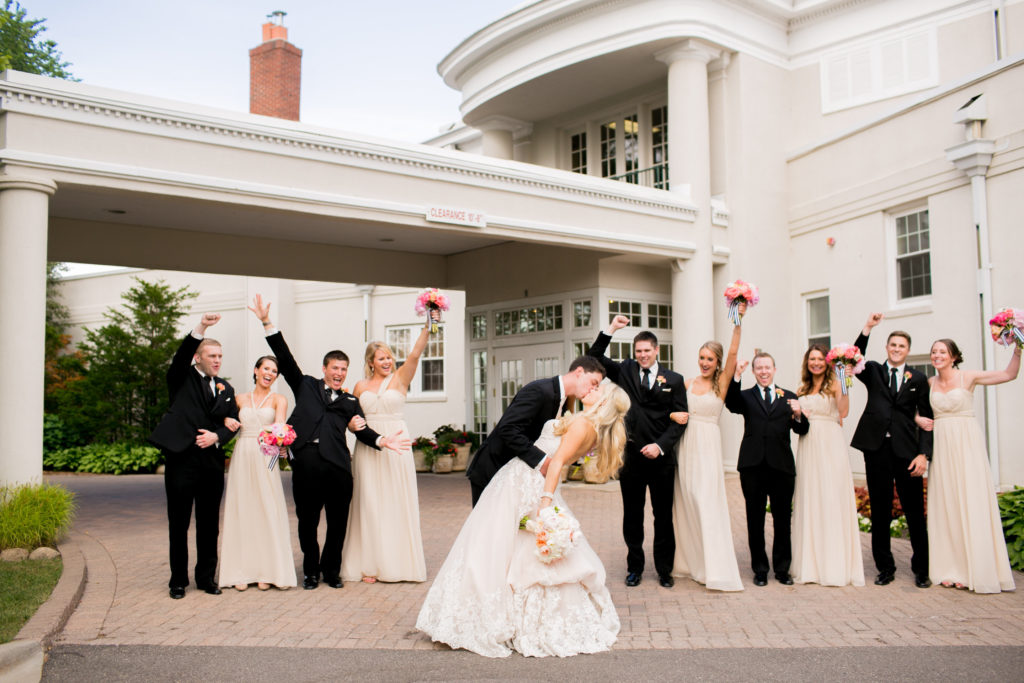 couple kissing in front of the golf club