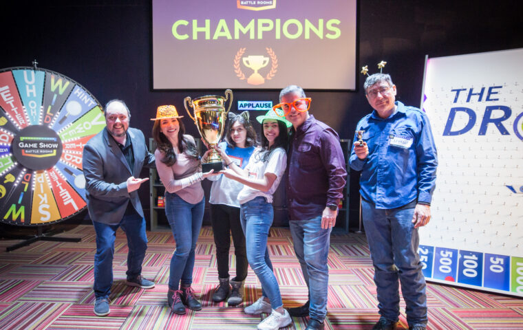 A family celebrating their win at Game Show Battle Rooms in Golden Valley