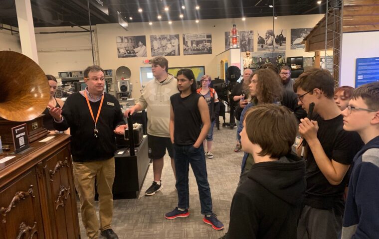 A group of people touring the Pavek Museum