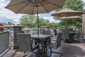 patio with umbrella-covered tables