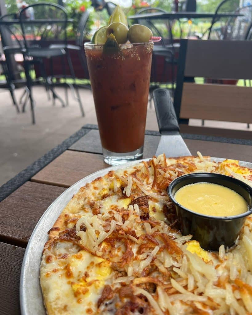 The Park Tavern's famous breakfast pizza accompanied with a bloody mary