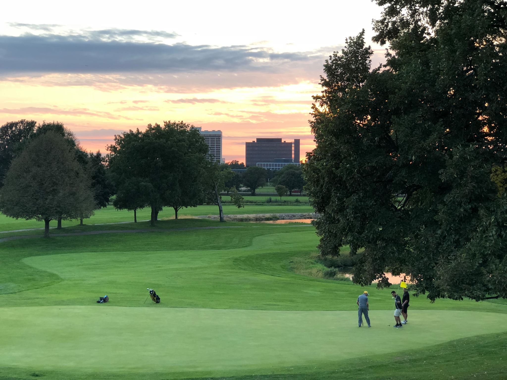 golfing at sunset