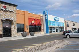 A photo showing the store fronts of Applebee's and Old Navy at The Shoppes at Knollwood